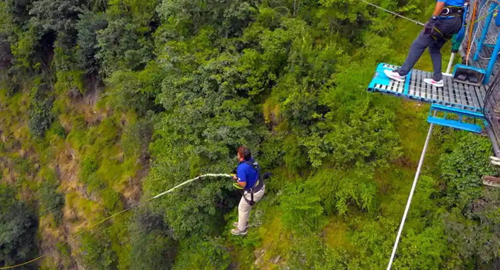 Bungee jumping over Bhote Koshi River from a high suspension bridge in Nepal