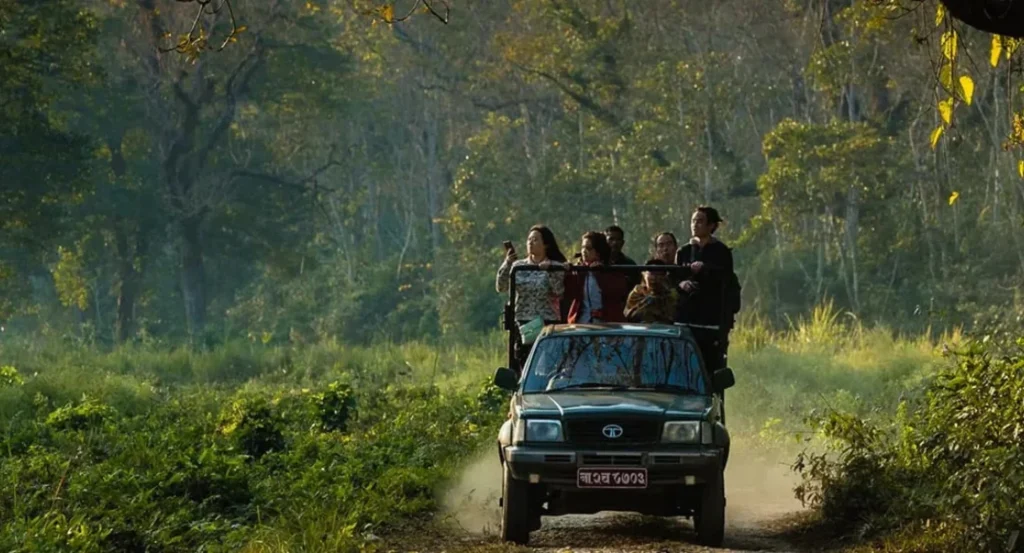 Jungle safari in Chitwan National Park with wildlife like rhinos, elephants, and crocodiles