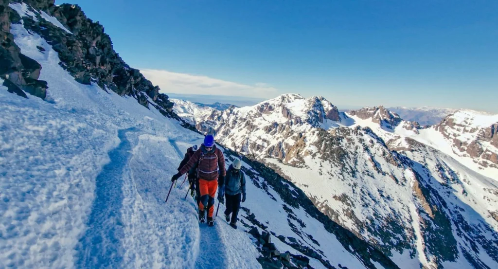 Mountaineering in Nepal with climbers ascending peaks like Island Peak, Mera Peak, and Mount Everest