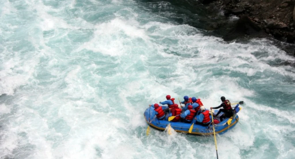 White water rafting in Nepal rivers like Trishuli and Bhote Koshi with fast rapids and scenic landscapes